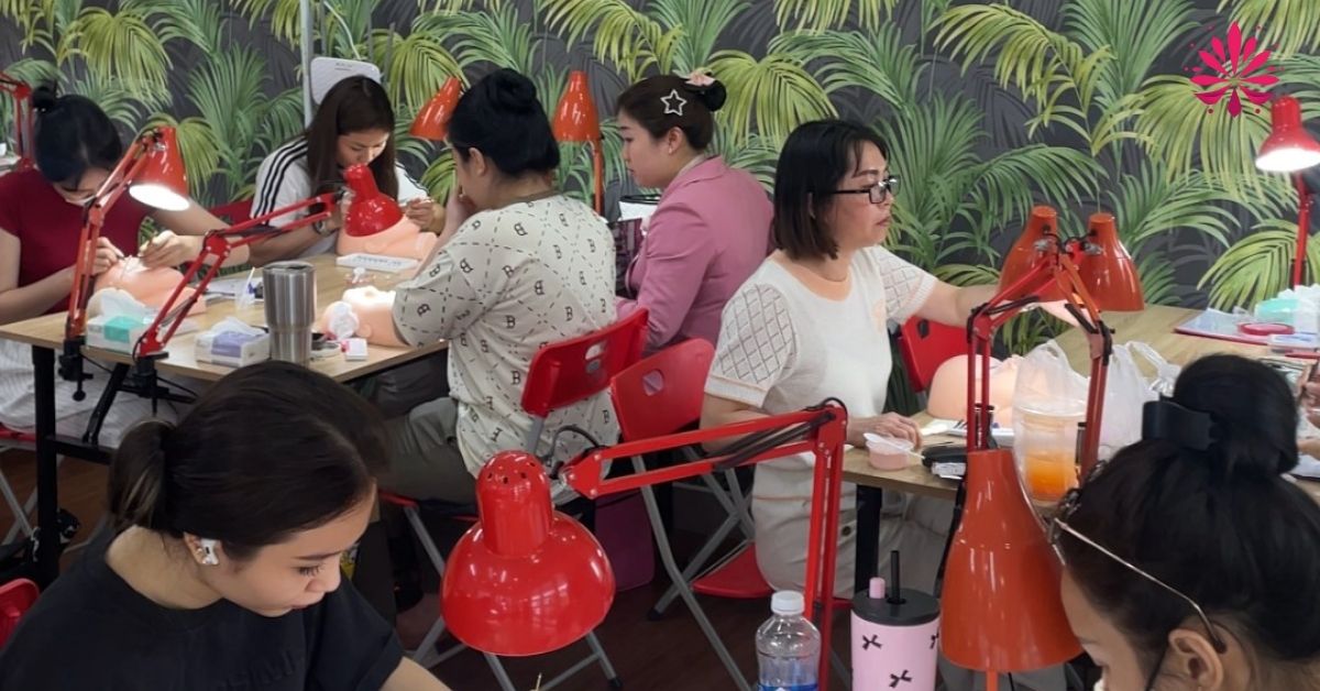 A group of women sitting at tablesAI-generated content may be incorrect.